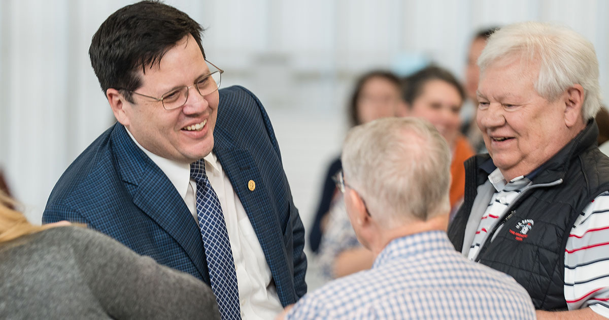 Jeremy McMillen, President of Grayson College, shaking hands with community members