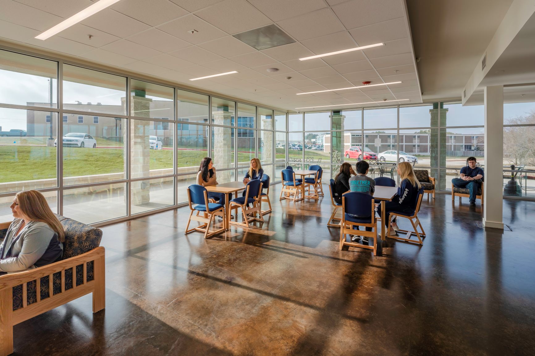 Indoor meeting space with several tables and chairs