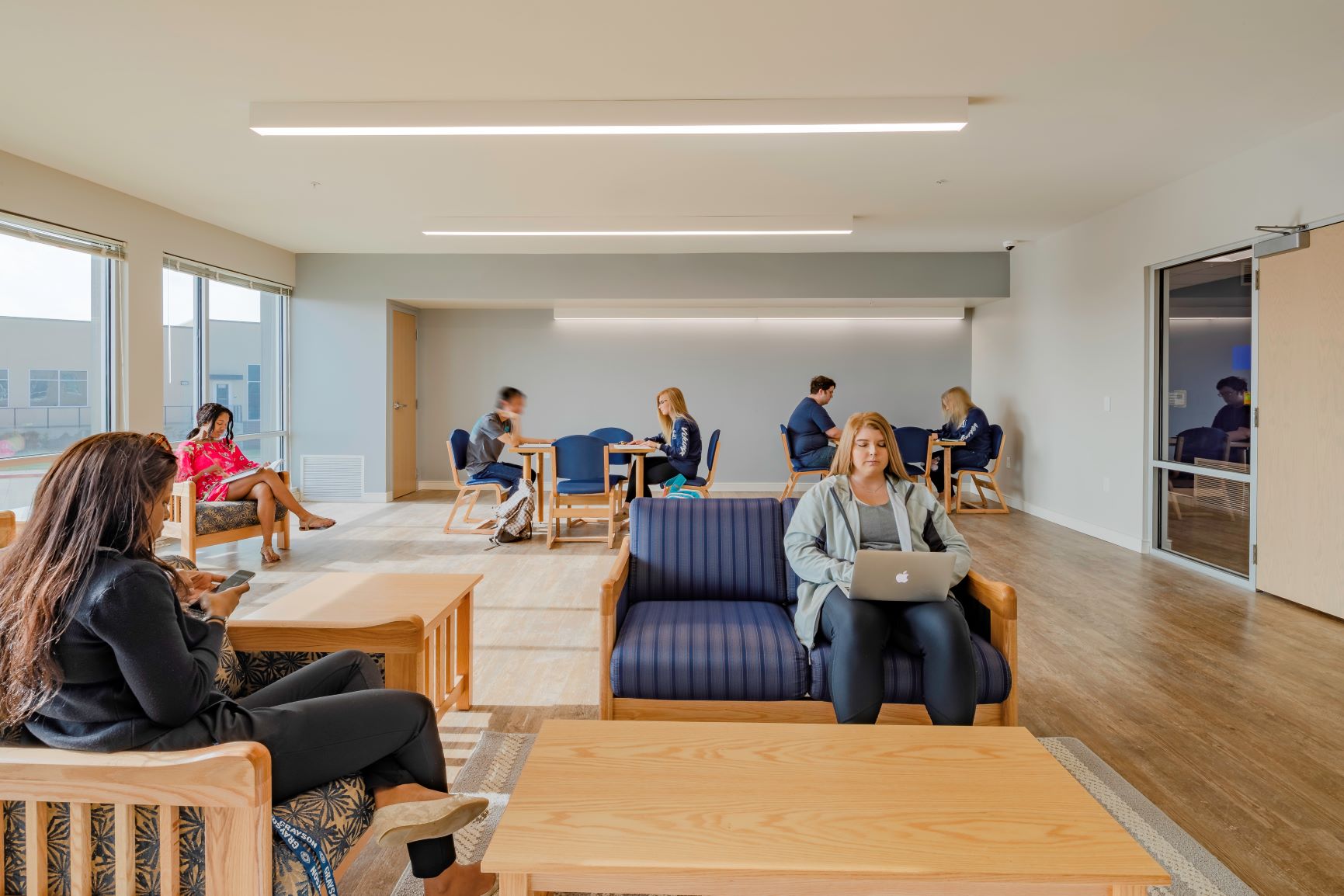 Indoor study area with tables and couches