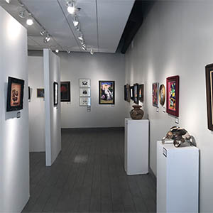 Second Floor Gallery with artwork hanging on walls