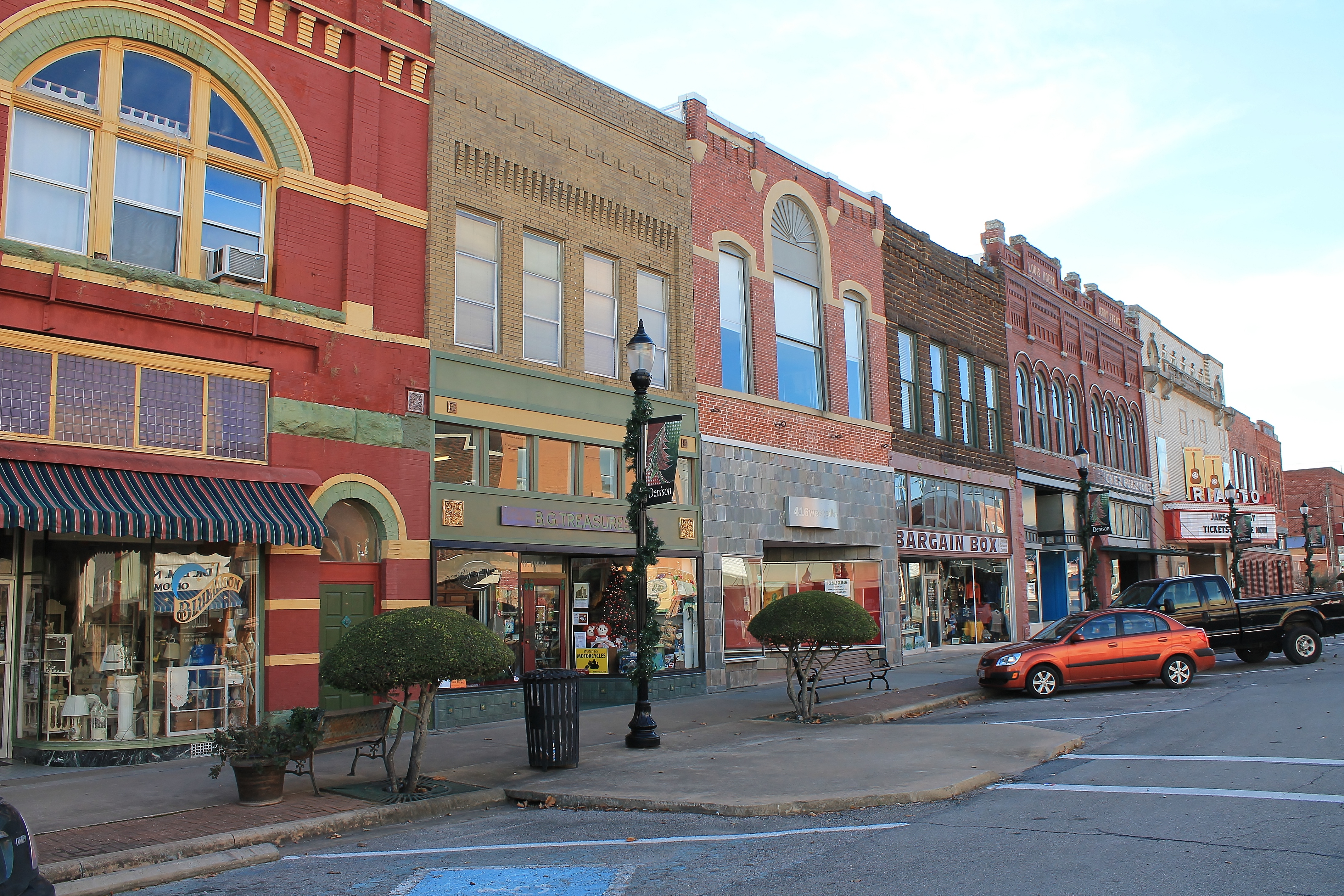 View of shops and restaurants lining historic commercial street in Denison TX