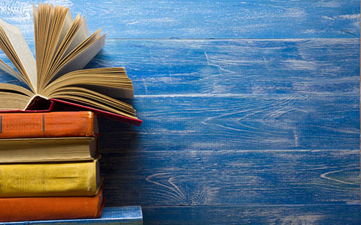 Books against a blue background