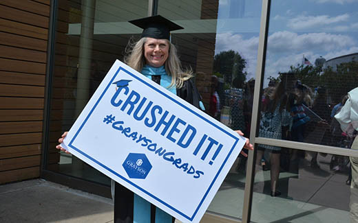 Krista Hartman wearing Academic Regalia