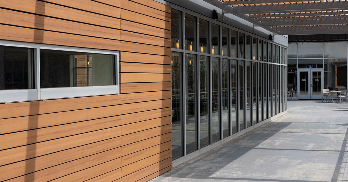 Walkway on second floor of life center showing exterior windows and seating