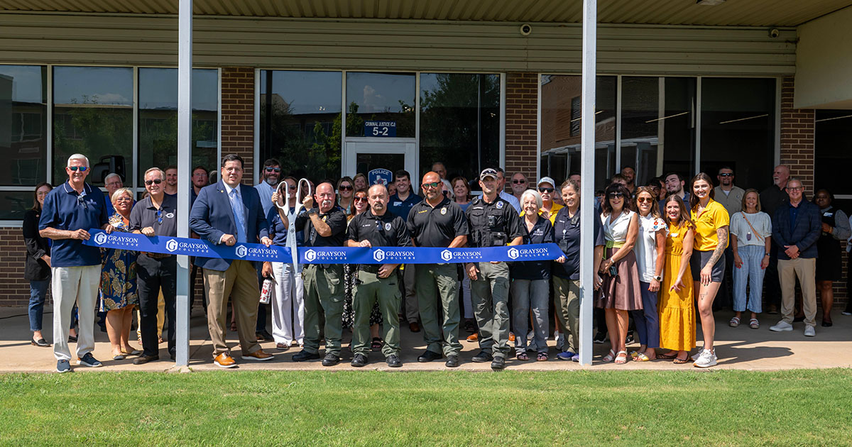 Grayson College staff posing for ribbon cuttting