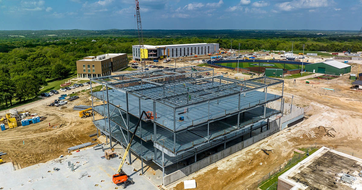 Drone view of construction on campus during the daytime