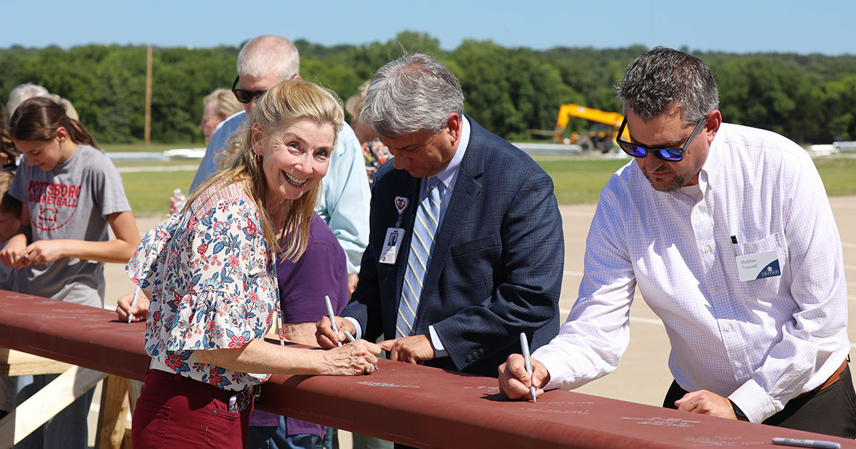 Grayson College staff and students sign beam of new health science center