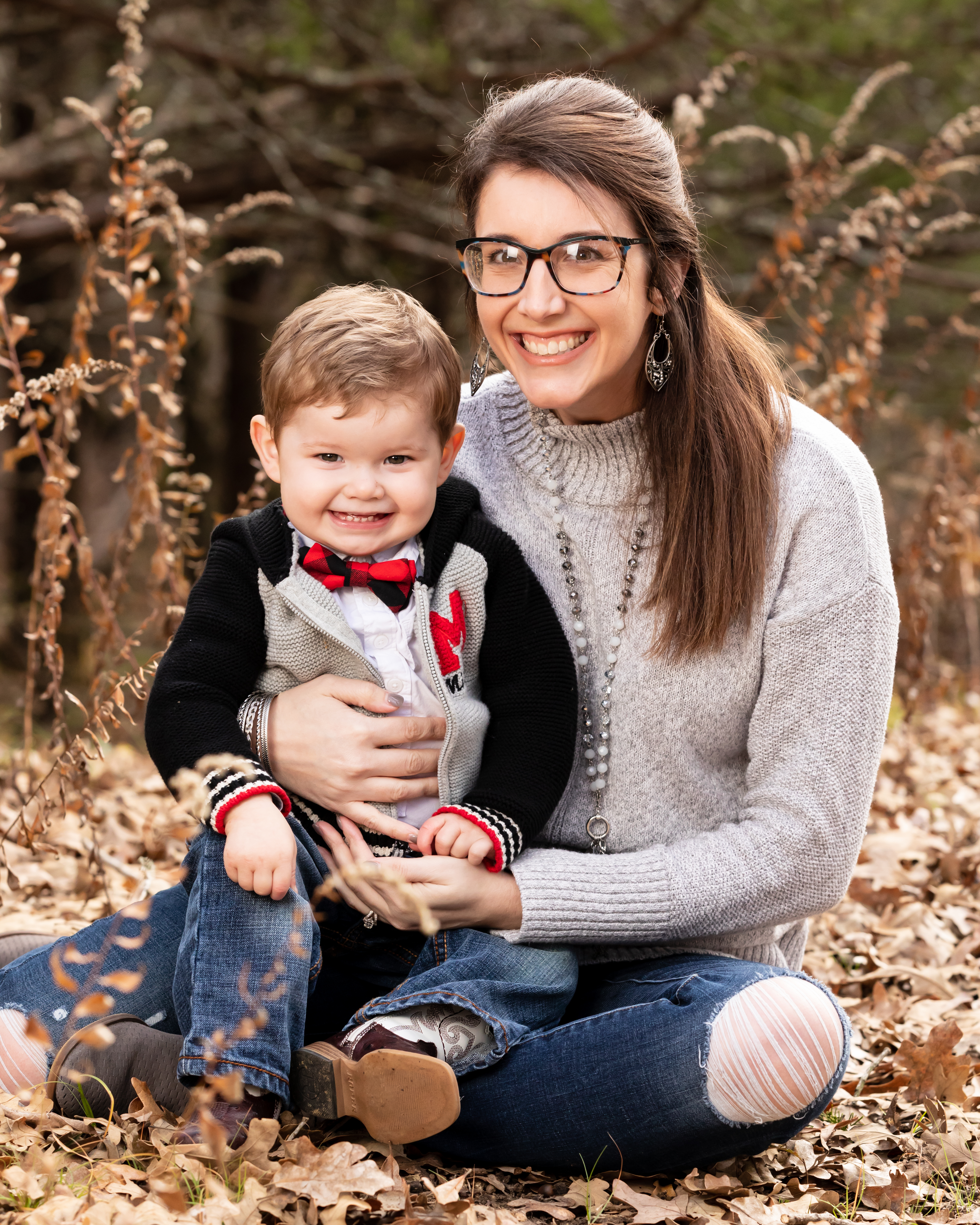 Logan Maxwell with Child outside during fall