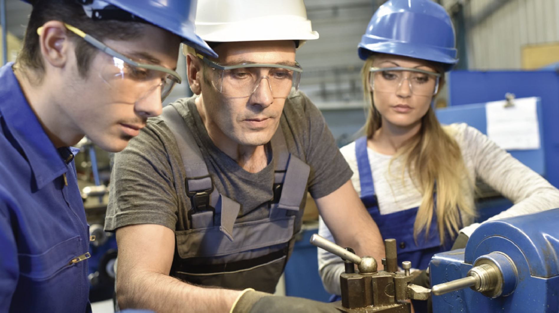 Manufacturers working at a lathe